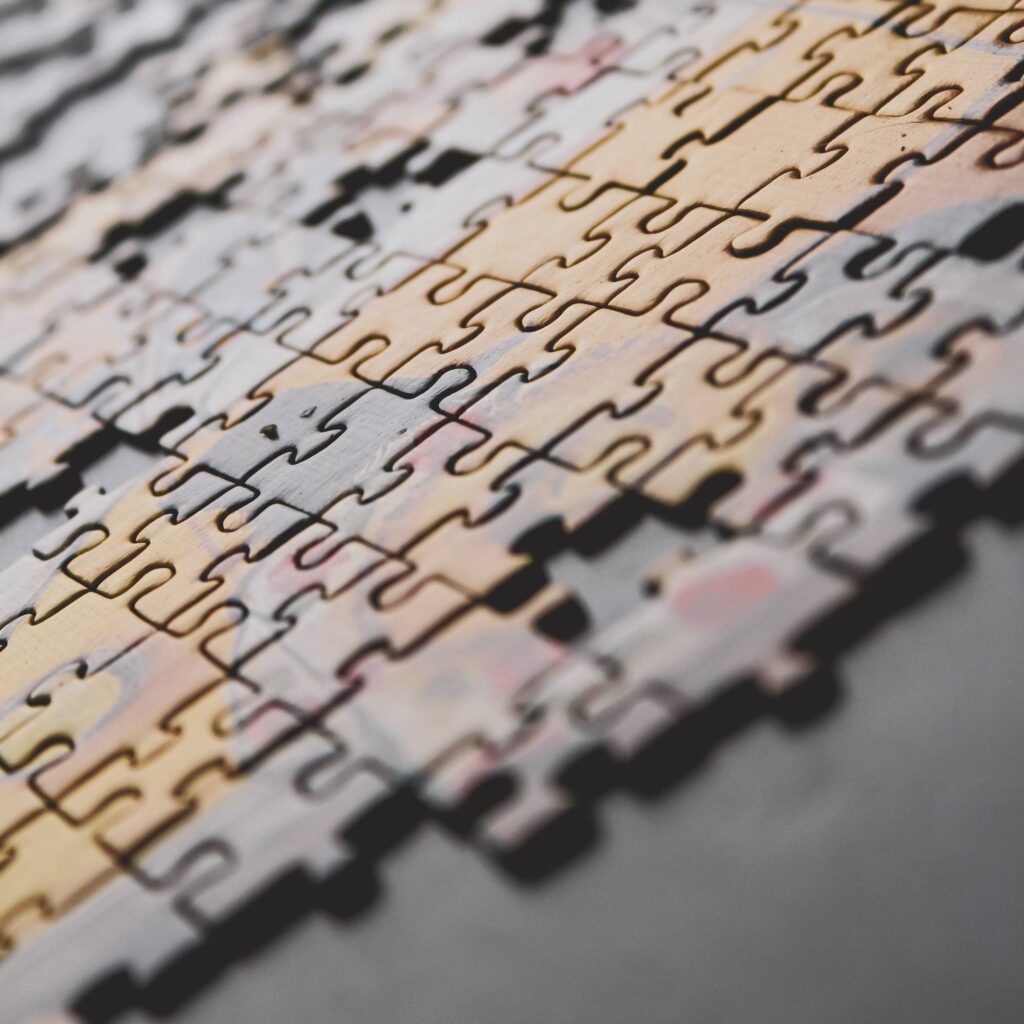 A partially completed puzzle with individual pieces missing.